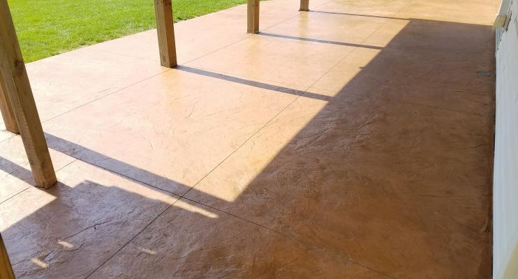 Stamped colored concrete under deck