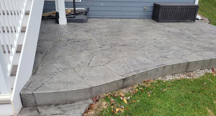 Vang Project Stamped Concrete Patio Under Deck in Minnesota