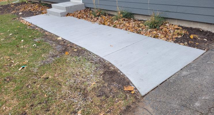 Otten Project concrete sidewalk and step